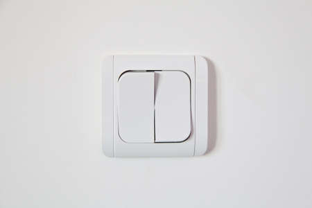 white light switch on white wallの写真素材
