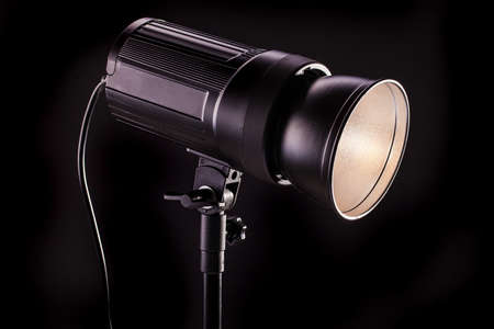 studio light strobes on black backgroundの写真素材