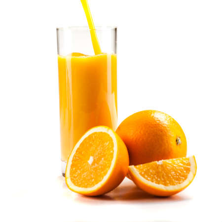 fresh healthy orange juice and slices of oranges, on white backgroundの写真素材