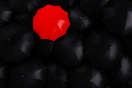 3d red umbrella on top of black umbrellasの写真素材