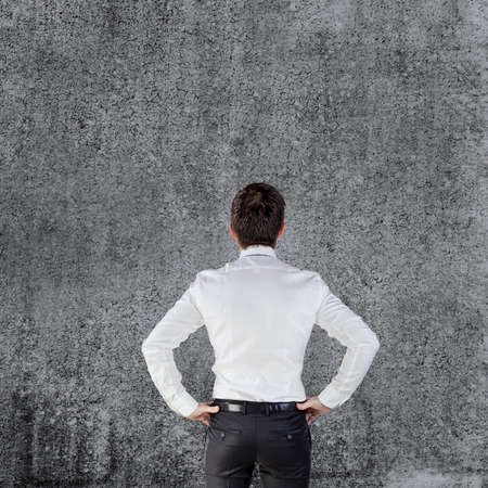 young businessman on grunge backgroundの写真素材