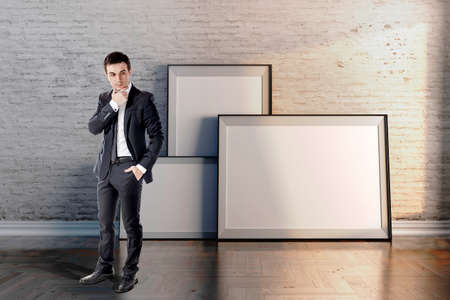 business man and blank frame on vintage wallの写真素材