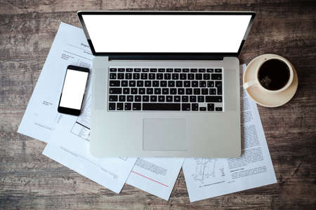 top view of work place with laptop and documentsの写真素材