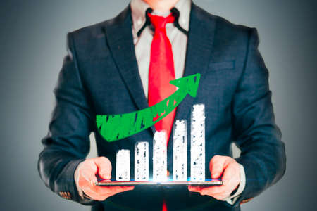 Close up image of business man holding a digital tablet の写真素材