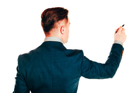 portrait of businessman in suit holding a pen on white backgroundの写真素材