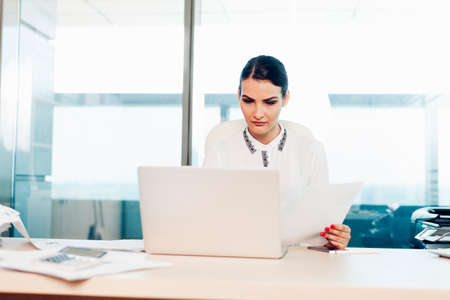 business woman working on laptop, office life