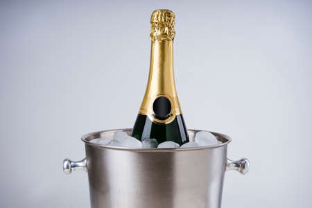 Luxury champagne bottle in ice bucketの写真素材