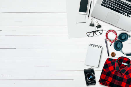 Hipster, designer workplace with laptop, photo camera and other accessories
