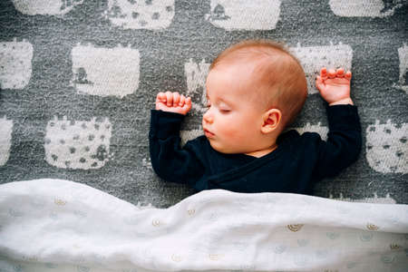 Cute little baby boy sleepingの写真素材