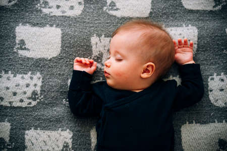 Cute little baby boy sleepingの写真素材