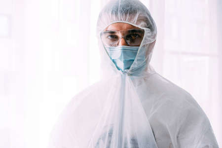 Man doctor or scientist waring protective suit, and face mask の写真素材