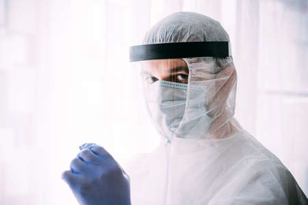 Man doctor or scientist waring protective suit, and face maskの写真素材
