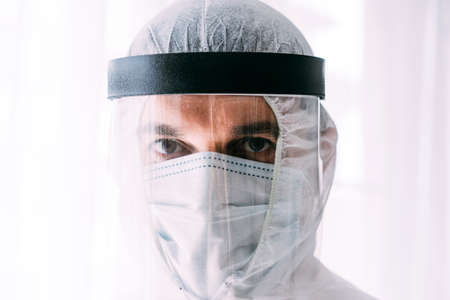 Man doctor or scientist waring protective suit, and face maskの写真素材