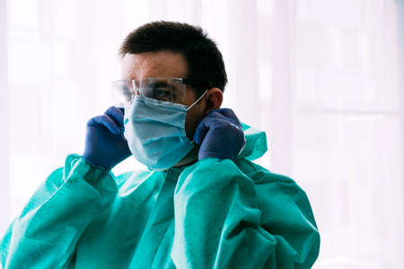 Man doctor or scientist waring protective suit, and face maskの写真素材