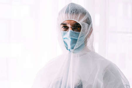 Man doctor or scientist waring protective suit, and face maskの写真素材