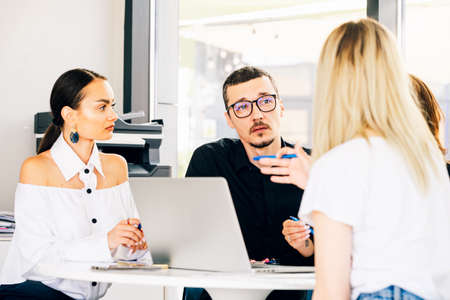 Young business colleagues working together at the officeの写真素材