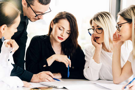 Young business colleagues working together at the office