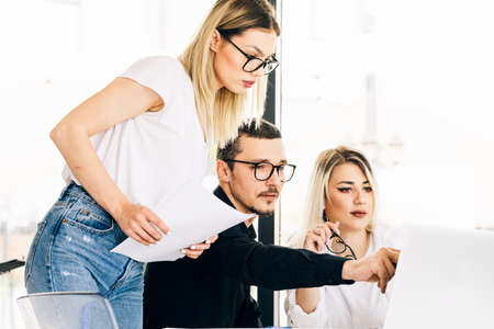 Young professional team. Creative people having a brainstorm meeting at the officeの写真素材