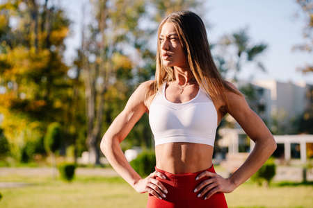 beautiful strong and fit woman working out outsideの写真素材