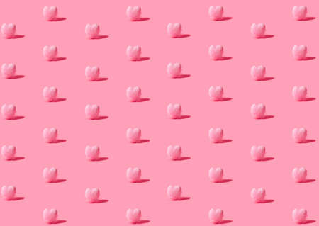 Isometric pattern created of small hearts covered with feathers in pink color. 45 degree angle on...