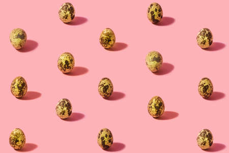 Minimal arrangement of organic natural quail eggs. Concept made with pastel pink background.