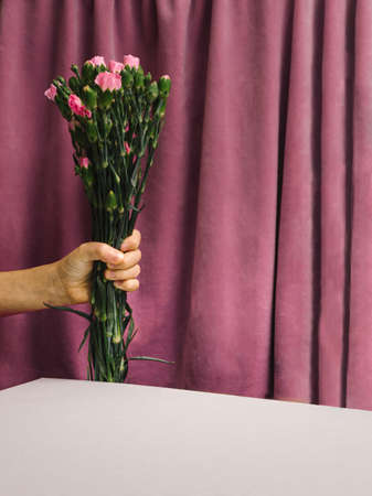 Motherâ€™s Day or International Women's Day (8th March) concept. A child hand handing over...
