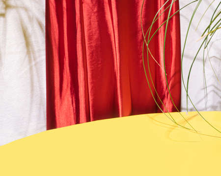 Creative retro layout made of yellow background for product placement or display with red velvet texture in the back with shade aroundの写真素材