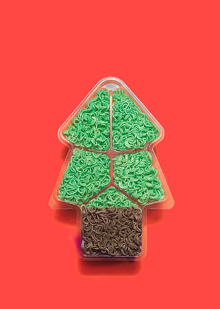 Festive lovely vegan eats concept. Tree look like shape dish with green noodles in it. Flat lay arrangementの写真素材