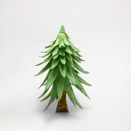 Holiday season concept. Pineapple leaves upside down arrangement against snow white backgroundの写真素材