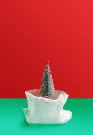 Environmentally issue inspired concept. Open plastic bubble wrap bag. Glitter silver artificial...