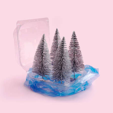 Environmentally issue inspired concept. Open plastic package wrapped in blue disposable blue bag...