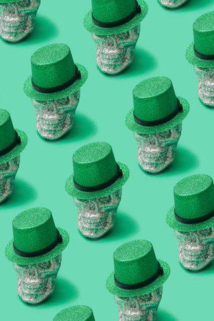 Awesome death-s-head minimal pattern concept. Silver glitter skull with green top of hat on it. Nice...