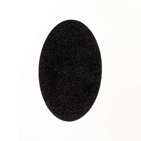 Black easter minimal concept. Optimistic flat lay arrangements made of awesome fluffy texture egg shaped with off white background.の写真素材