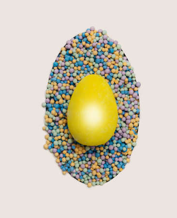 Awesome minimal Easter concept.  Flat lay little yellow egg arrangement with creative egg shapes...