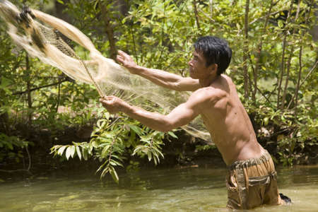 Fishing with a throw netの写真素材