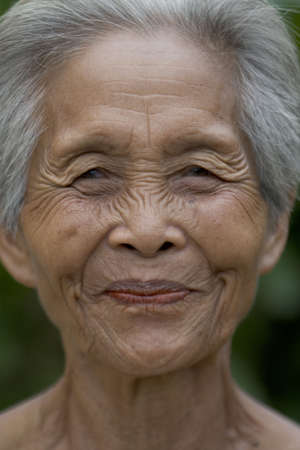 Portrait of an old Asian woman with gray hairの写真素材