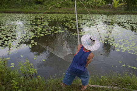 Fisherman with stave, Asiaの写真素材