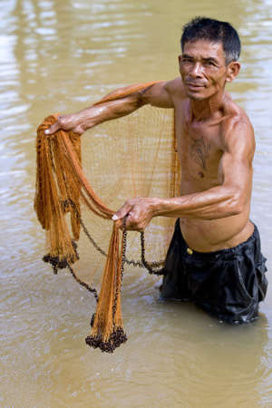 Fisherman of Thailand with throw netの写真素材