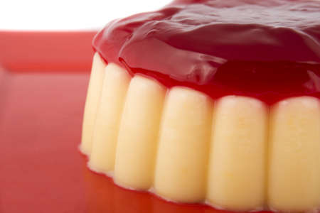 Vanilla pudding with strawberry sauceの写真素材