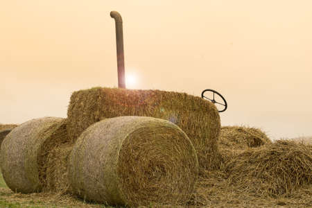 Tractor from bales of strawの写真素材