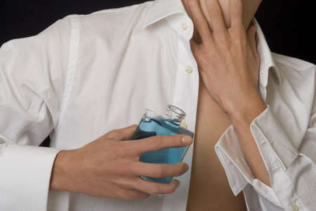 Man with perfume bottle Man with perfume bottle