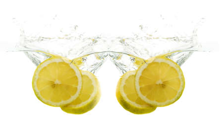 Lemons fall into the waterの写真素材