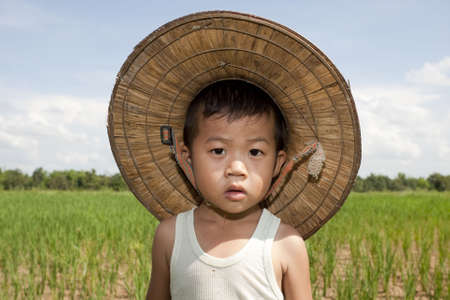 Portrait Asian child in the paddy fieldの写真素材