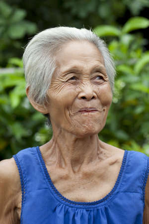 Portrait old woman Asia, friendly senior with grey hairの写真素材