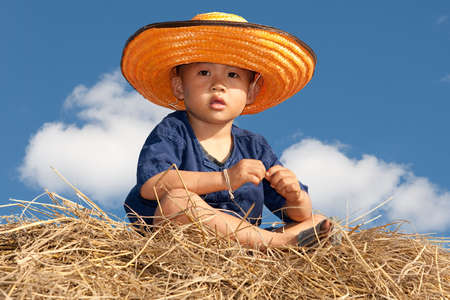 boy of Asia sit on strawの写真素材