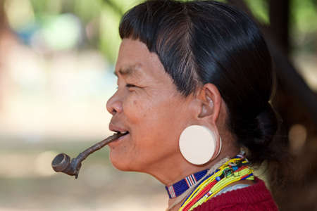 old woman with pipe in Asia, ethnic group Lawae in Laosの写真素材