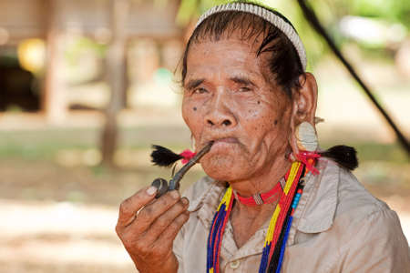 Portrait asian man lawae with pipe