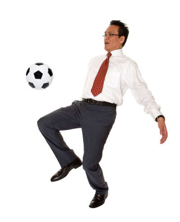 Businessman plays soccerの写真素材