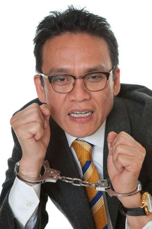 Businessman with handcuffs