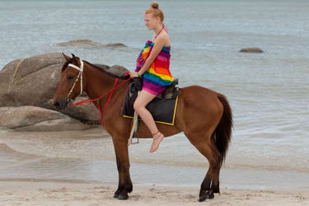 Horse riding on the beachの写真素材